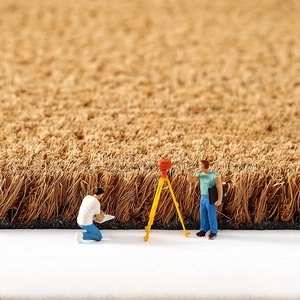 Macro view of natural coconut fiber doormat highlighting thick durable construction