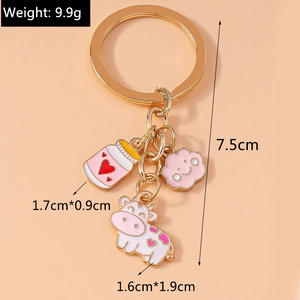 Detail showing dimensions of cartoon cow and milk bottle enamel keychain pendants