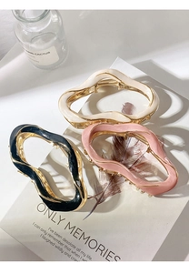Three irregular wave metal hair claws in black pink and cream beige colors