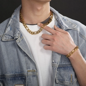 Men's hip hop gold titanium Figaro link chain necklace and bracelet jewelry set on model