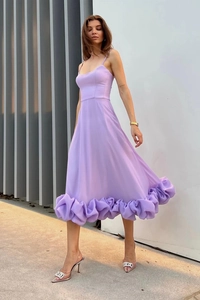 Detail showing lavender sleeveless dress with fine spaghetti straps and ruffled hemline
