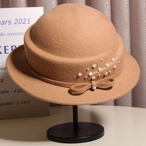Elegant brown wool cloche hat with ribbon bow and pearl flower detail for women