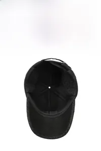 Detailed view of winter baseball cap with ear flaps and warm thick fleece lining