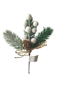 Macro detail of Christmas spray with snowy red berries, pine cone and jute bow decoration