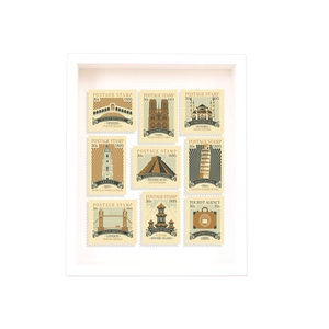 White 3D shadow box frame with nine vintage international landmark postage stamp illustrations