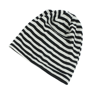 Close-up of black and grey striped knit beanie showing soft fabric texture and weave