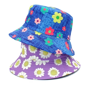 Detail of blue and purple floral bucket hats with high-quality stitching and fabric texture