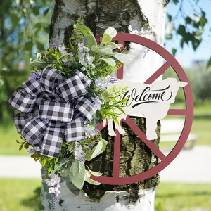 Rustic farmhouse cow-themed welcome wreath with wooden wheel and lavender decor