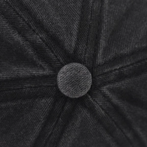 Macro view of the top button and textured corduroy fabric of the dog mama baseball cap