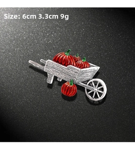 Detail view of a Halloween pumpkin carriage brooch with dimensions 6cm by 3.3cm