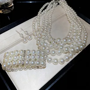 French style multi-layer pearl necklace, bracelet and earrings jewelry set on velvet tray
