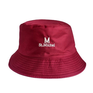 Detail of burgundy bucket hat featuring white letter embroidery and premium fabric texture