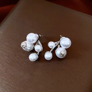 Elegant irregular pearl drop earrings with silver needles and luxury minimalist design