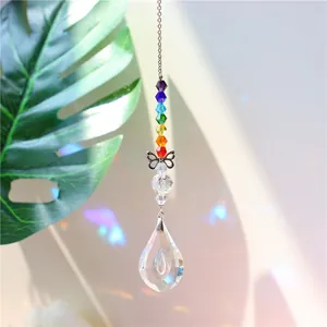 Detail of crystal suncatcher featuring rainbow octagonal beads and a water drop pendant