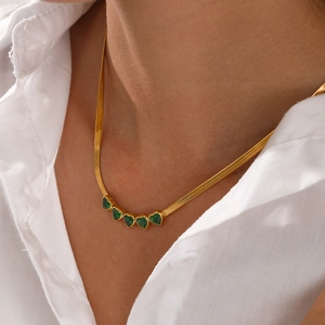Golden herringbone chain necklace with five emerald heart-shaped gemstones for women