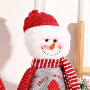 Standing Christmas snowman decoration with red knit hat and silver sequins glitter finish