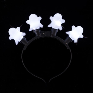 Close-up of Halloween LED headband with four glowing white ghost charms on black base