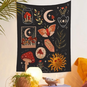 Detail of artistic black tapestry with mushroom moon and sun patterns on white wall