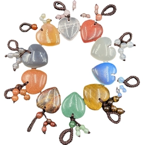 Agate crystal heart pendant collection with woven ropes in various vibrant colors