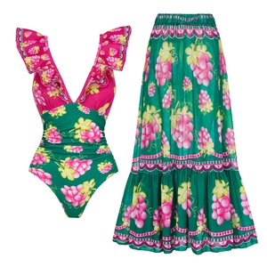 Detail of green one-piece swimsuit and matching maxi skirt with grape leaf prints