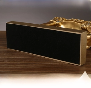 Close-up of golden horse figurine base with anti-slip pad and sparkling rhinestones