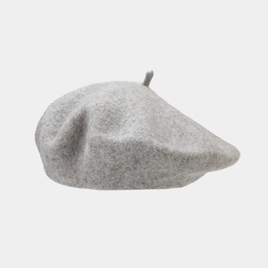 Close-up of grey wool beret showing premium fiber texture and neutral melange finish