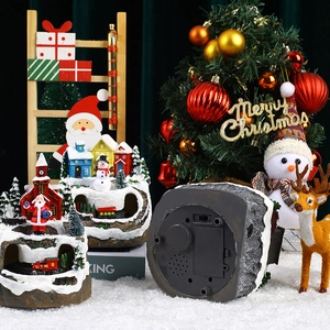 Miniature Christmas snow village set with rotating train, music, and LED lights