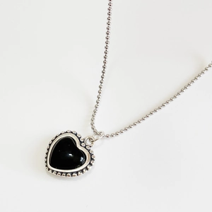 Elegant S925 sterling silver ball chain necklace featuring a polished black heart pendant
