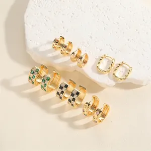 Gold hoop earrings set with colorful zircon and enamel patterns in various sizes