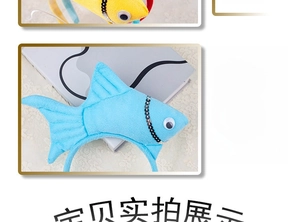 Close-up of creative blue and yellow plush fish headband with sequins and 3D eyes