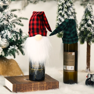 Christmas gnome wine bottle covers in red and green plaid for festive holiday table decor