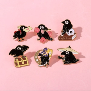 Detailed set of six black enamel crow pins with magic owl and bird motifs on pink