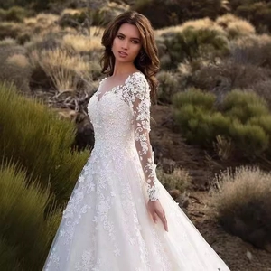 Elegant off-shoulder lace wedding dress with long sleeves and full A-line tulle skirt