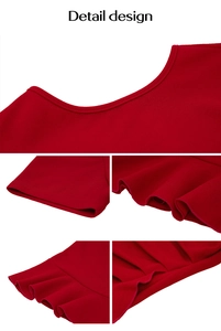 Close-up of elegant red dress featuring a round neckline and ruffled edge detailing