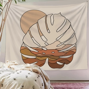 Bohemian style wall tapestry with abstract monstera leaf and sun in warm earthy tones
