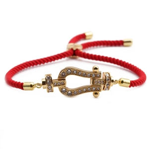 Adjustable red braided rope bracelet with gold-plated horseshoe buckle and zircon