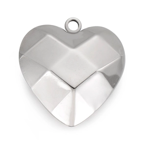 Macro view of silver stainless steel heart pendant with geometric diamond cut texture