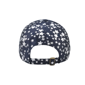 Detail of adjustable bronze buckle and star pattern on dark blue baseball cap back
