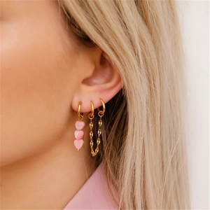 Elegant gold chain tassel earrings with pink heart charms for a stylish women's jewelry look