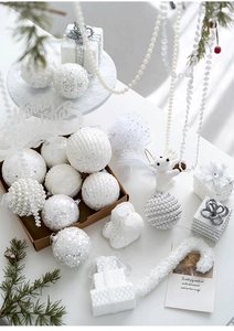 Close-up of white champagne Christmas baubles with pearls and sequins for tree decoration