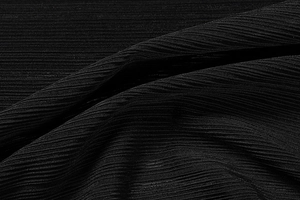 Detailed view of black ribbed knit fabric showing fine texture and elastic vertical stripes