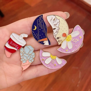 Cute enamel pins featuring coffee cup ice cubes and nature designs on golden metal