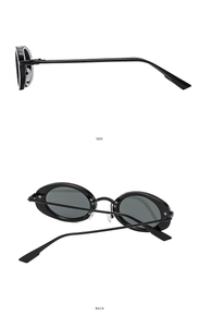 Detail view of oval black sunglasses showing side temples and hinge construction