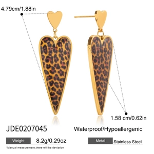 Detail shot of leopard print heart earrings with dimensions 4.79cm and 1.58cm on white back