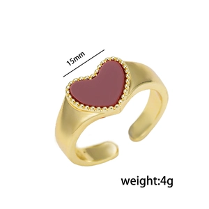 Adjustable golden heart ring with red enamel shell and beaded border design