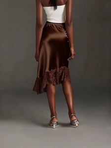 Back view of elegant brown satin midi skirt featuring delicate lace patchwork hem detailing