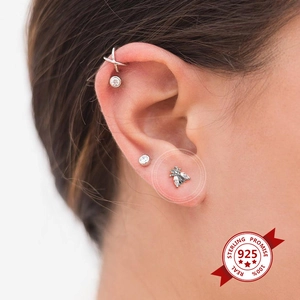 Detailed view of S925 silver bee earrings and zircon ear cuffs worn on the ear