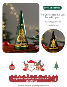 Detail of cone Christmas tree night light with golden snowflake pattern and warm LED glow