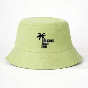 Light green cotton bucket hat with Beaches Love Me palm tree print on a white background
