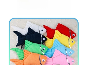 Detail showing plush fish headbands in various colors with sequins and 3D design
